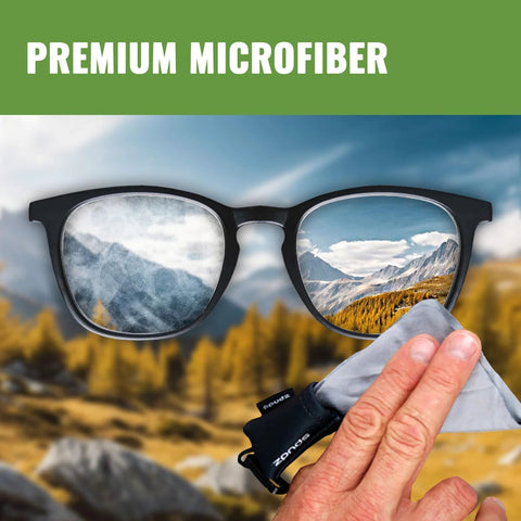 SPUDZ microfiber cloth screen cleaner for glasses; gray cloth held near black eyeglasses with mountain-scene reflections on the lenses