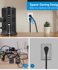 16Ft Power Strip Tower With 12 Outlets And 5 USB Ports ETL Surge Protector on desk with flat plug connected, showing space-saving design.