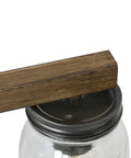 Close-up of Rustic Farmhouse Vanity Light With Mason Jar Glass Shades, faux wood finish and metal detail, 29-inch bathroom lighting