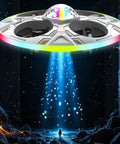 UFO Drone For Kids Indoor Flying Toy Remote Control Aircraft with LED lights flying over dark rocky landscape