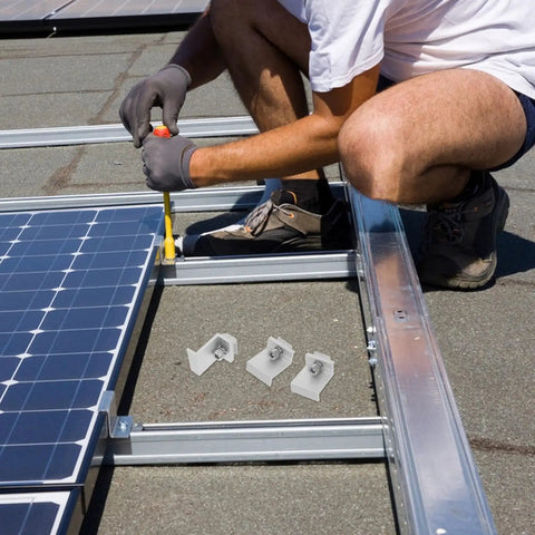 Installation of 12 Piece Top Shelf M8 Aluminum Alloy Solar Panel Mid Clamps on a rooftop racking system.