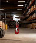 Heavy Duty Forklift Lifting Hook Attachment Single Fork Mount Boasting A Smooth 360 Degree Swivel And 4400 Pound Capacity in warehouse.