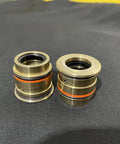 Waterjet seal cartridge pair in brass with orange and black O-rings for 100000 psi water jet intensifier pumps