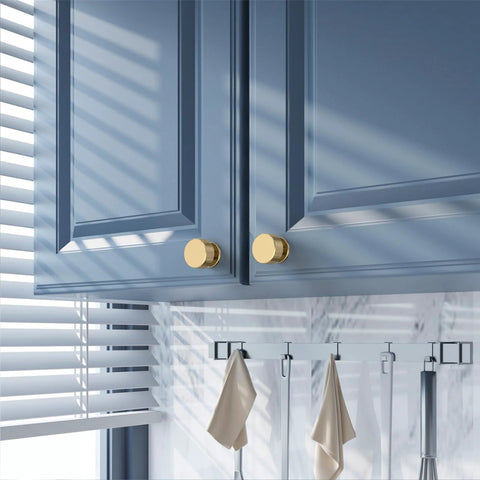 Champagne Bronze Knurled Cabinet Knobs, 1.2 Inch Diameter, installed on blue cabinets, single hole mount, zinc alloy hardware.