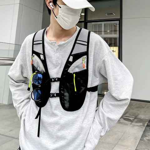 Hydration Vest For Outdoor Adventures With Easy Access Water Bladder System Reflective Front Chest Pocket And Multiple Storage Pockets Lightweight Gear Built For Trekking Camping Cycling And Mountaineering in use.