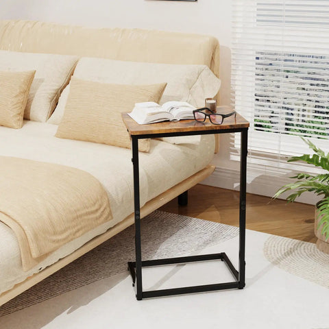 Living room with a C Shaped End Table for Couch and Small Spaces, Under Sofa Side Table that Slides next to a beige sofa.