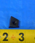 Black heavy duty insert wedge clamp for BW2 indexable tool holders, precise machining, shown next to measuring tape.