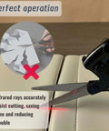 Side view of MXHLXRMP laser-guided fabric scissors with ergonomic black handle cutting fabric