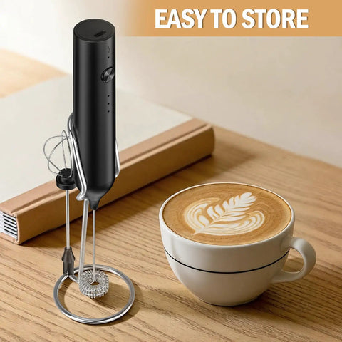 Rechargeable Handheld Milk Frother Electric Whisk With Three Speeds Dual Whisk Heads Portable Coffee Frother next to latte