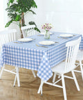 Buffalo Gingham Waterproof Vinyl Tablecloth Heavy Duty Wipeable Checkered Table Cover Outdoor Patio Picnic Camping 54 X 78 Inches Light Blue Spillproof PVC Protector on dining table with white chairs and floral centerpiece.