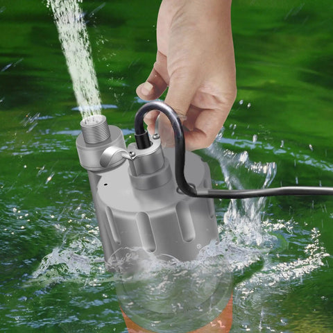 Hand holding 2000 GPH Submersible Water Pump for Quick Drainage in water