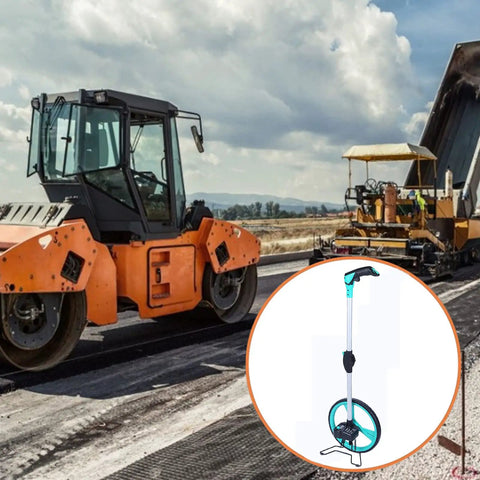 Heavy Duty Large Road Construction Measuring Wheel With Mechanical Counter And Telescopic Handle beside construction machinery on site.