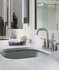 Two-Handle High Arc Bathroom Faucet In Spot Resist Brushed Nickel Finish on modern countertop, ADA Compliant
