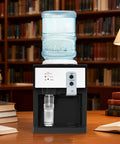 Top Loading Hot And Cold Desktop Water Dispenser With 500W Heating And 75W Cooling Delivers 1.32 Gal Per Hour Hot Water 110V US Plug White Water Cooler For Home Office And Desk Setup on wooden desk with books