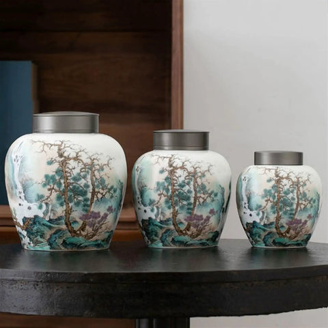 Large Ceramic Kitchen Storage Jars With Dual Sealed Alloy Lids Keep Your Tea Coffee Beans And Candy Stash Nice And Crisp In This Heavy Duty Pantry Setup, three artistic canisters on a table.