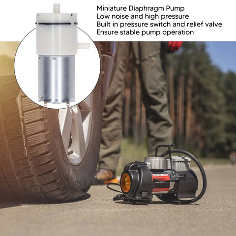 Boss Level 12V Micro Air Pump Featuring Rock Solid Aluminum Body, Self Priming Diaphragm Vacuum Pump Offering Ultra Quiet Operation, Dual Output Valves, Built In Pressure Switch, No Mess Setup For Aquariums And Home Projects. Mini diaphragm pump beside tire, showcasing aluminum construction and low noise operation.