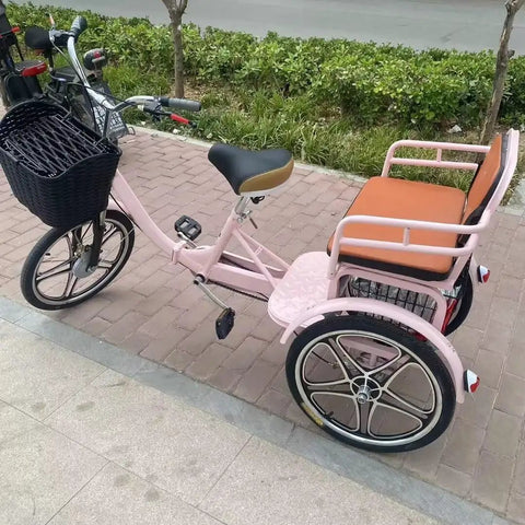 Hassle Free Fold Tandem Tricycle For Adults And Seniors With Rear Bucket Seat And Locking Safety Strap 20 Inch Front Wheel Heavy Duty Steel Frame Bright Pink Chill City Cruisers side view parked with basket.