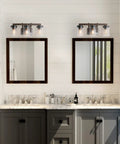 Bathroom with Rustic Faux Wood Three Light Farmhouse Vanity Light With Clear Glass Shades Distressed Black Backing And Decorative Panels