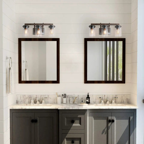 Bathroom with Rustic Faux Wood Three Light Farmhouse Vanity Light With Clear Glass Shades Distressed Black Backing And Decorative Panels