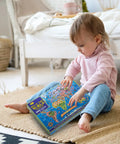 Child sitting with Large 200 Piece World Map Puzzle For Kids And Adults Floor Jigsaw Map For Learning Geography box.