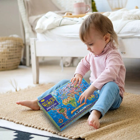 Child sitting with Large 200 Piece World Map Puzzle For Kids And Adults Floor Jigsaw Map For Learning Geography box.