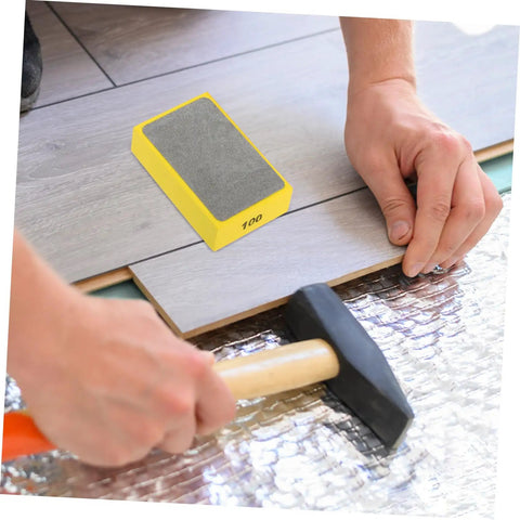 Person using Handheld Diamond Sanding Pads For Ceramic Tiles And Marble Polishing Rock Stone Edge Trimming Block Kit Easy Grip Hand Grinding Pad on tile floor.