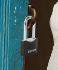 All Weather Outdoor Padlock Set Keyed Alike, solid steel lock securing blue door, black cover visible