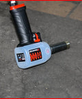 Pro Shop Essential 1/2 Drive Pneumatic Impact Wrench on a workshop floor showcasing ergonomic grip and durable design.