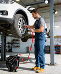 Hardcore Workhorse Retractable Air Hose Reel Runs 50 Ft Of Hybrid Polymer Tubing With Slick Auto Rewind Tech in use for tire inflation.