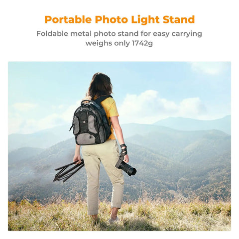 Person holding Heavy Duty Light Stand for Photography 9.1ft Extendable Tripod Built Tough with Stable Base in outdoor setting