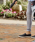 Person using Ready To Use Weed Killer With Comfort Wand Max Control 365 Kills Weeds To The Root And Keeps Them Gone For Up To 12 Months 1.33 Gal Easy Spray For Driveways Yards And Garden Beds outdoors