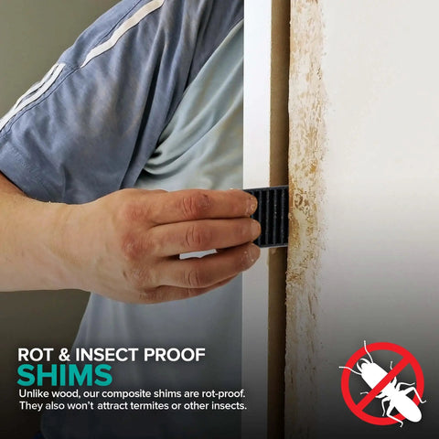 Person inserting Heavy Duty Composite Shims 576 Pack Leveling Wedges Built Tough into door frame for rot and insect protection.