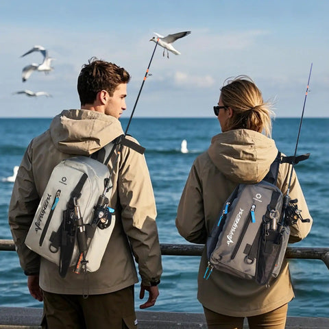 Two people with fishing sling bags and rod straps by the ocean, showcasing the lightweight portable tackle organizer for men.