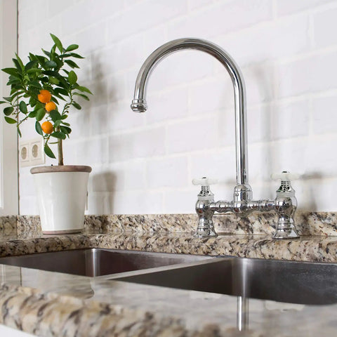 Cross-Arm Tub Shower And Sink Faucet Handle For 2-3 Handle Faucets Chrome And White Porcelain Finish Swap-In Replacement Kit installed on kitchen sink