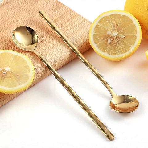 Gold Tone 6.7 Inch Long Handle Coffee And Tea Spoons Set Of 4 Stainless Steel Dope Stirring Spoons with lemons on a wooden board