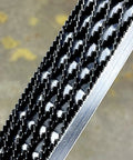 Close-up of Japanese rasp and sanding block quick swap blades non clogging teeth, showcasing detailed coarse rake teeth.