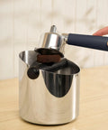 20 Bar Slim Espresso Maker With 1300 Watt Pump And 360 Degree Steam Wand For Silky Microfoam with portafilter and coffee puck.