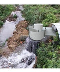 Portable 150W Micro Axial Flow Hydro Generator For Low Head Water Turbine 12V 24V DC Off Grid Hydropower System Built For Small Streams Easy Install And Reliable Power On The Go installed over a stream.