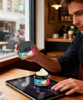 Person using All In One Laptop Repair Kit With Nano Polishing Paste For Scratches On Laptops Tablets Smartphones And Other Electronics Easy Application For A Quick Fix Up And A Shine Like New on a tablet in a cafe.
