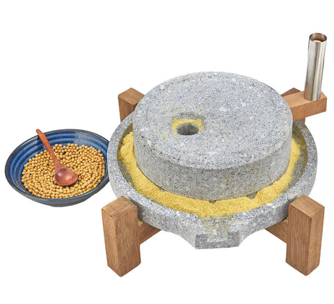 Manual Stone Grain Mill For Dry And Wet Grinding with granite stone top, wood base, and adjacent bowl of grains.