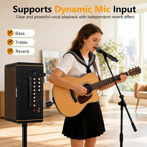 Woman singing with guitar next to 40W Acoustic Guitar Amplifier With Bluetooth And Battery Powered Portable Stereo Speaker.
