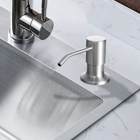 Stainless Steel Built In Soap Dispenser Pump For Kitchen Sink With Forty Seven Inch Extension Tube And Eleven Point Eight Four Ounce Soap Bottle Kit Brushed Nickel installed next to a faucet on a stainless steel sink
