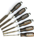 Heavy Duty Bevel Edge Chisel Set Featuring Heat Treated Alloy Steel Blades And Contoured Wooden Grips For Quick Woodworking Carves laid out for precision use.