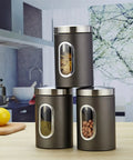 3Piece Stainless Steel Coffee Canisters With Wide Mouth Design Keep Your Grind Fresh No Cap Perfect For Nuts Pasta And Tea Kitchen Storage Setup Game Changer arranged on countertop.