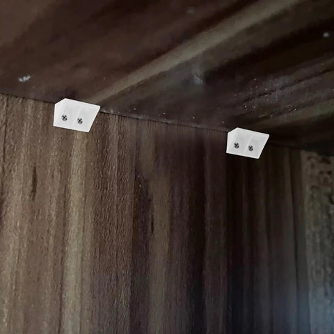 White Plastic Corner Brackets 20-Pack, 90-Degree Shelf Supports With Four-Hole Design installed in wooden cabinet corner