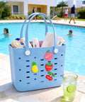 Spacious EVA Rubber Beach Tote Bag For Women Waterproof And Sandproof beside pool with fruit designs and green drink