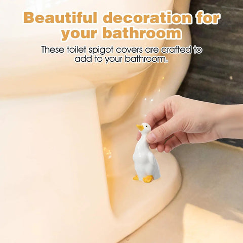 Adorable Ceramic Duck Toilet Bolt Covers Two Pack Decorative Screw Caps With Slick White Finish And Universal Fit shown near toilet.