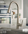 Slick Spot Resist Stainless One Handle Single Hole Pull Down Kitchen Faucet Featuring Power Boost Technology And Wrench Free Quick Connect For Supercharged Water Flow And Zero Hassle Setup close-up with water flowing