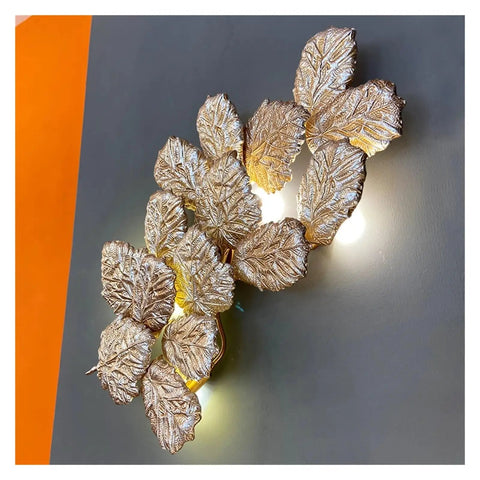 Top Shelf Modern Wall Sconce With Chill Ambient Glow For Living Room And Bedroom Background Decoration Built Like A Tank Perfect For TVs And Snug Spaces, featuring a decorative leaf design.