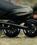 Close-up of Inline Skate Wheels 64mm 70mm 72mm 76mm 80mm Set With ABEC 9 Bearings For Indoor And Outdoor Use under a skate on grass.